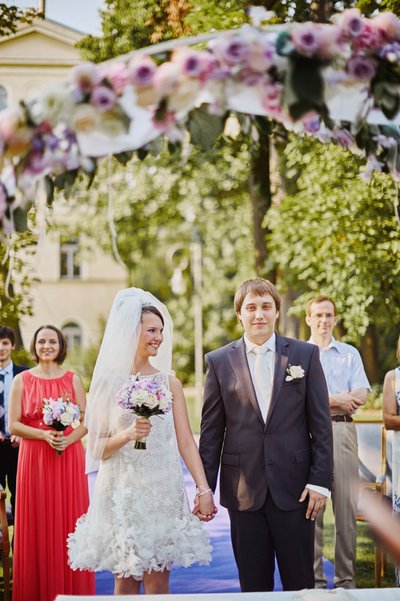 bride smiles towards groom