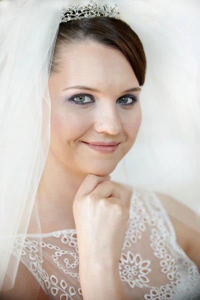 Bride resting chin on hand