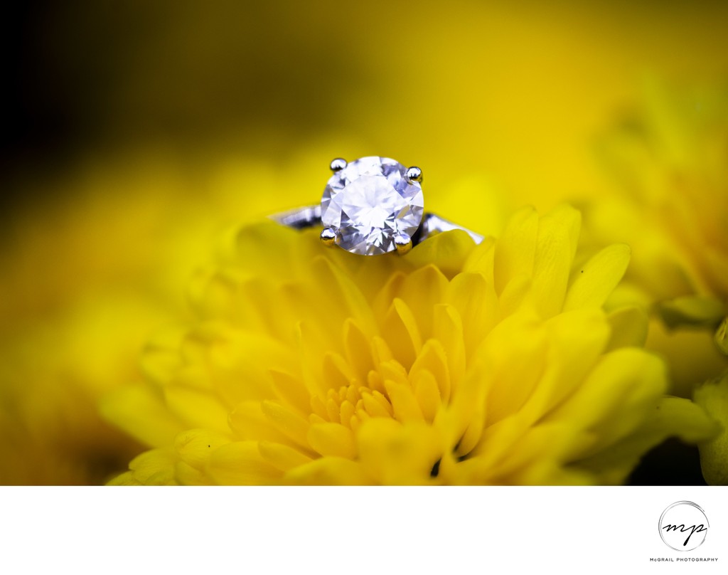 Sparkling Engagement Ring on Yellow Flower