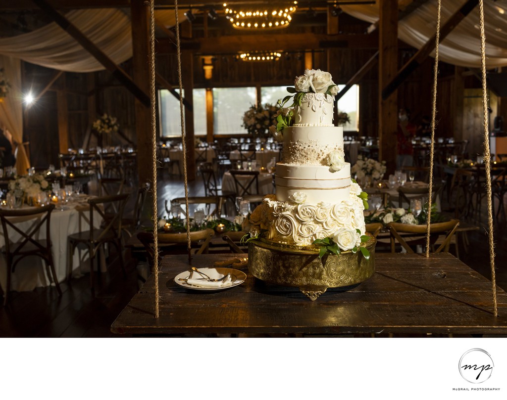 Elegant Wedding Cake in Rustic Reception Venue
