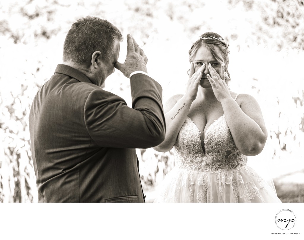 Emotional Father and Bride Sharing a Tearful Moment