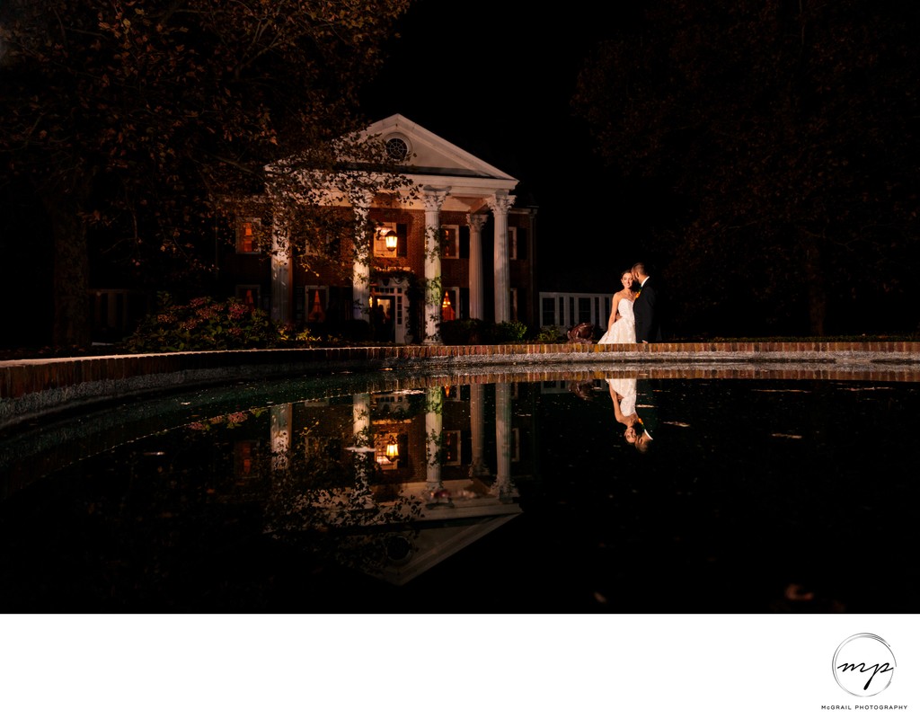 dramatic wedding portrait of couple with reflection