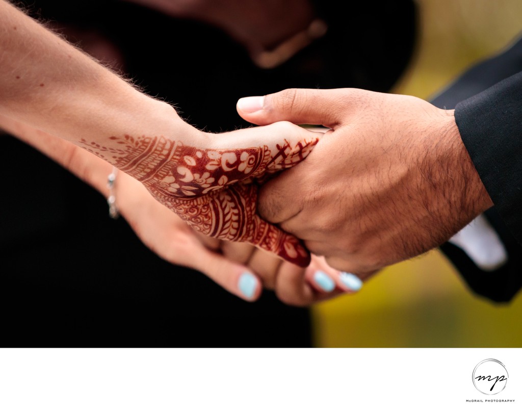 Henna-Adorned Hands in Unity