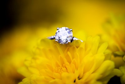 Sparkling Engagement Ring on Yellow Flower