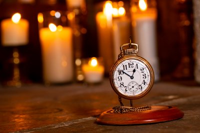 Vintage Pocket Watch Surrounded by Candlelight