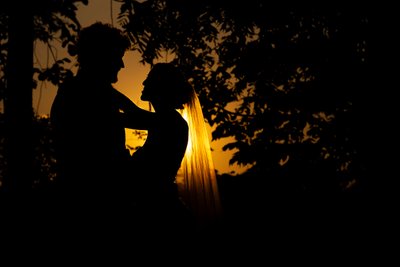 Golden Sunset silhouette of couple in new England  