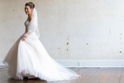 Joyful Bride Twirling in Elegant Wedding Dress