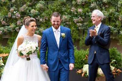 Joyful Newlyweds Exiting Wedding Ceremony at Excelsior