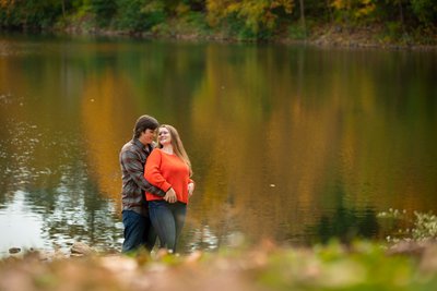 Engaged Couple Enjoying a Romantic Moment by the Lake