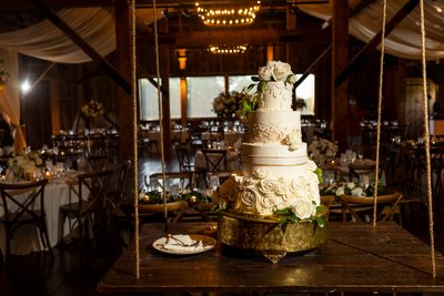 Elegant Wedding Cake in Rustic Reception Venue
