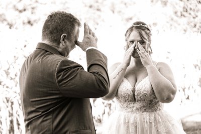 Emotional Father and Bride Sharing a Tearful Moment