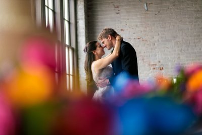 Romantic Embrace of Newlyweds in Industrial Venue