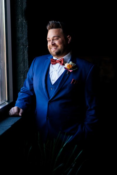 Charming Groom in Dramatic Light with  Blue Suit 