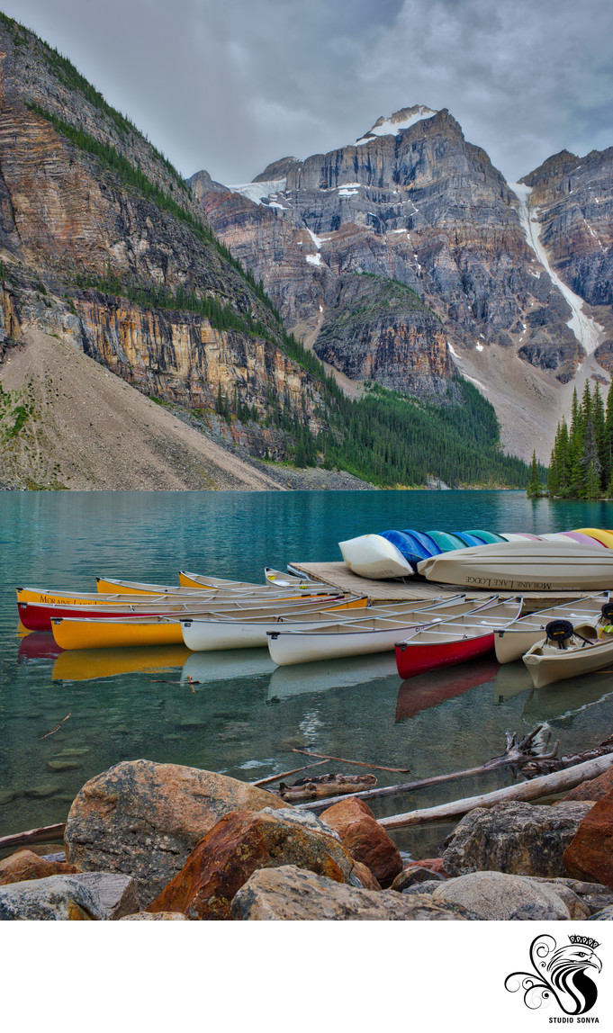 Moraine Lake and canoe dock with Wenkchemna Peaks. Banff 