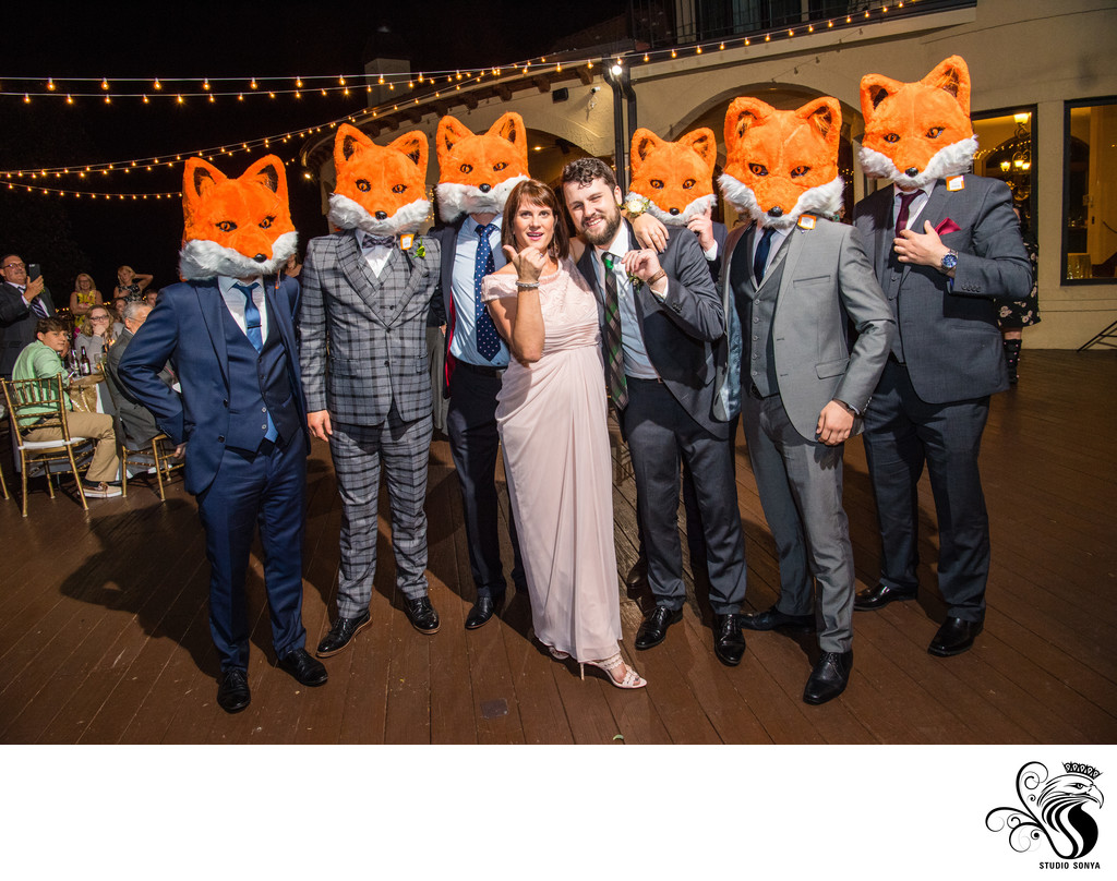 Fun Photo of Groom and Mother with Wedding Guests