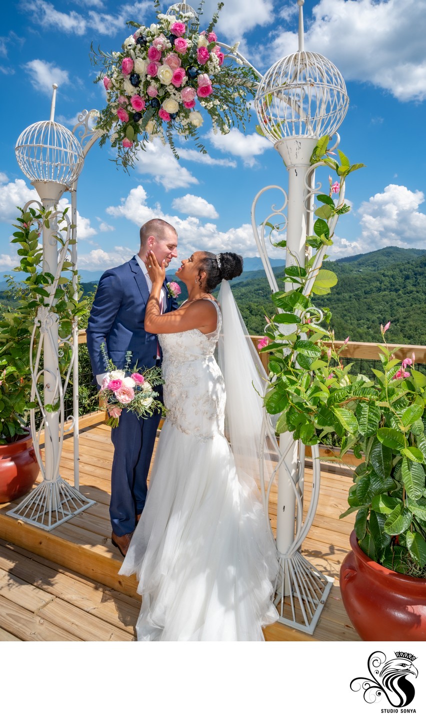 Bride and Groom posing with Smoky Mountains as backdrop