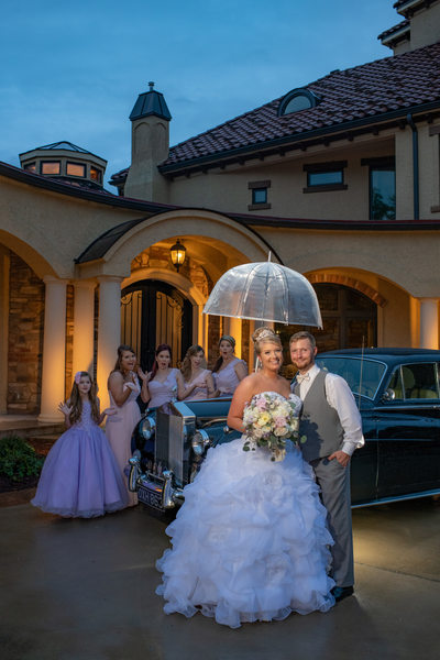 Couple and Bridesmaids in the Rain