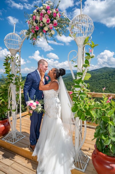 Bride and Groom posing with Smoky Mountains as backdrop