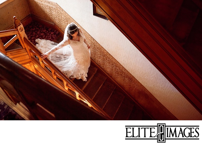 Dubuque Wedding Photography of bride walking down the stairs