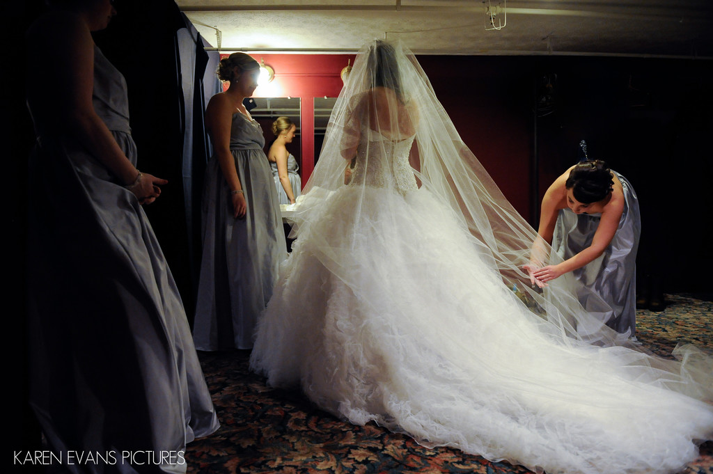Bridesmaids Helping Bride with Veil
