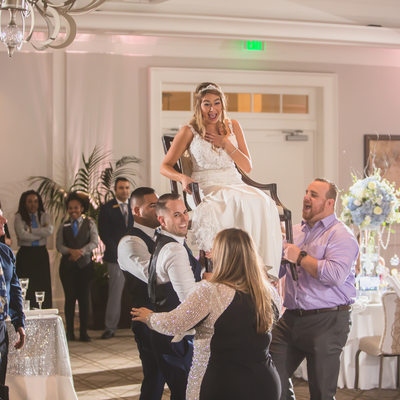 JEWISH WEDDING PHOTOGRAPHY HORA CHAIR DANCE