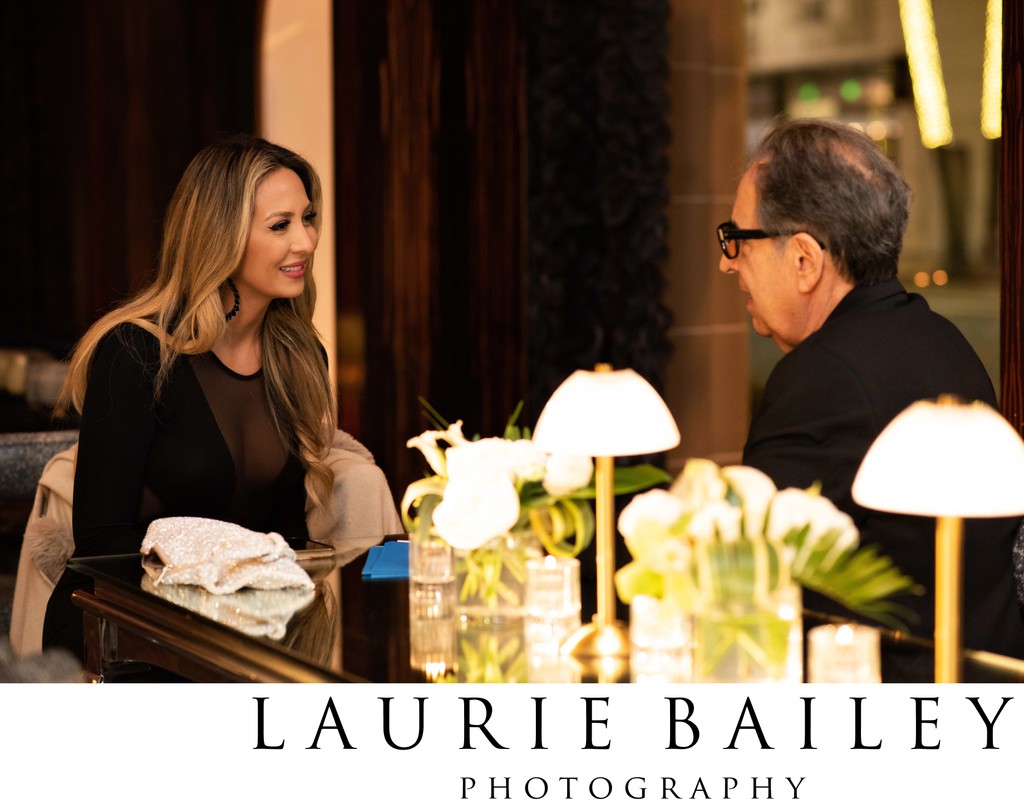 Guests share a candid moment at Beverly Wilshire Hotel event
