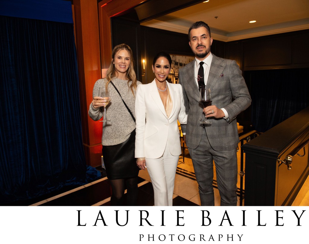Three guests pause for a photo at Beverly Wilshire Hotel