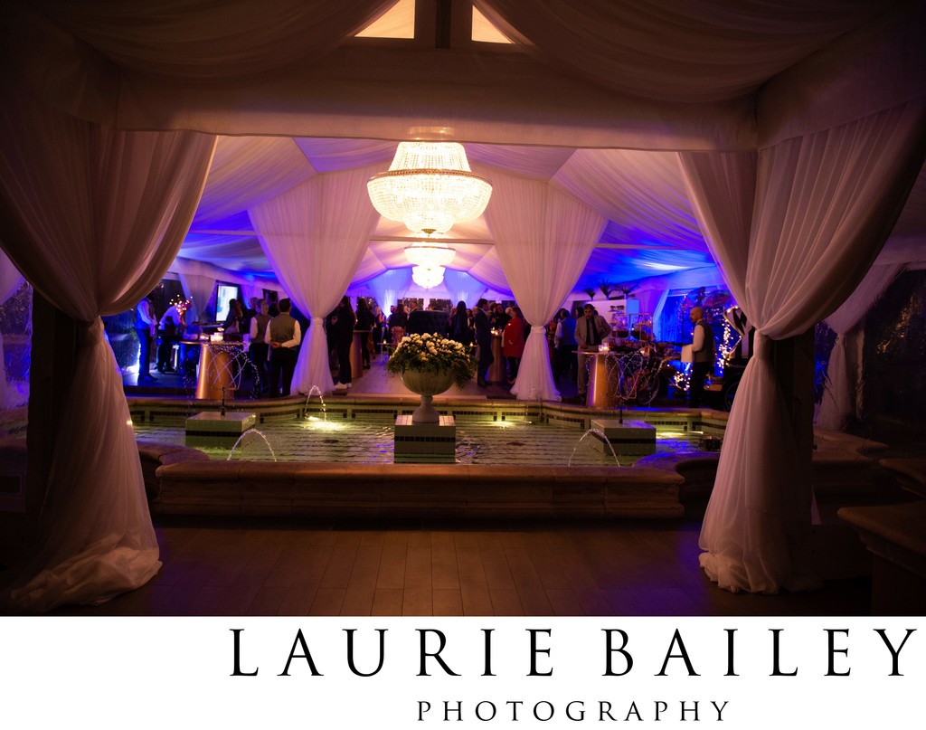 Blue uplighting inside a Beverly Hills ballroom reception.