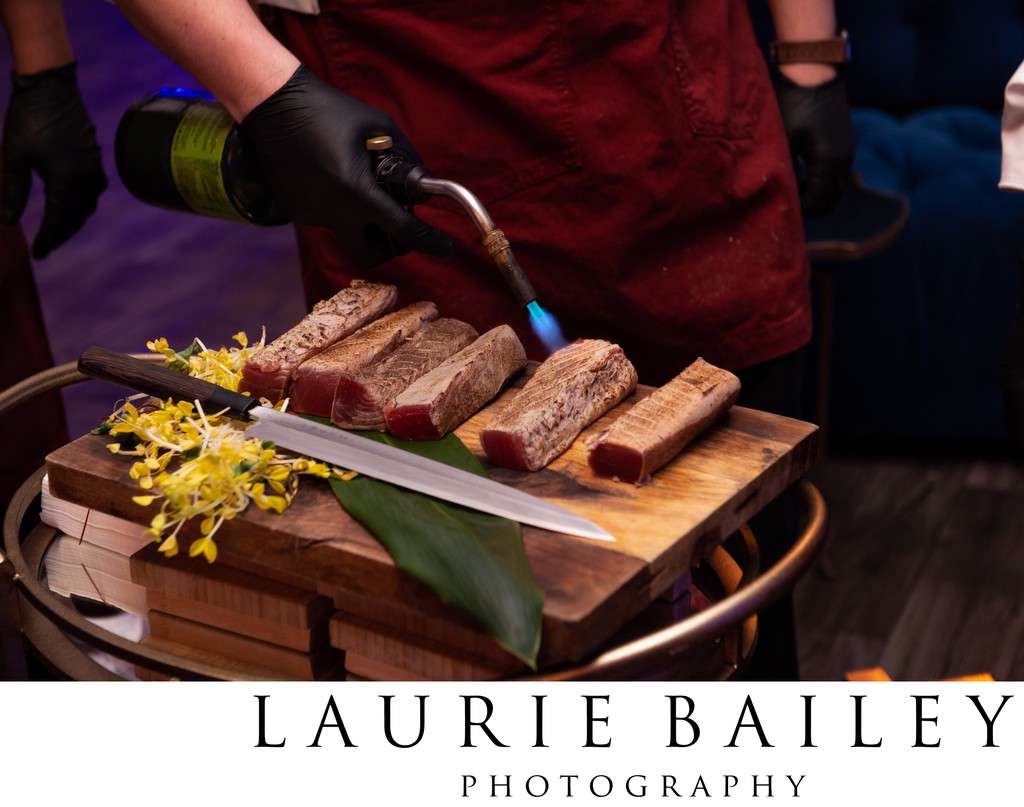 Chefs sear ahi tuna tableside at the Regent Beverly Wilshire