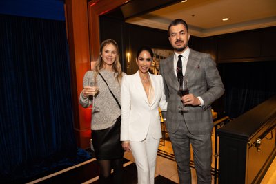 Three guests pause for a photo at Beverly Wilshire Hotel