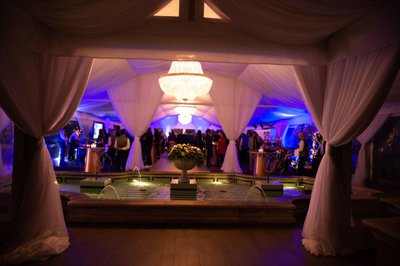 Blue uplighting inside a Beverly Hills ballroom reception.