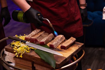 Chefs sear ahi tuna tableside at the Regent Beverly Wilshire