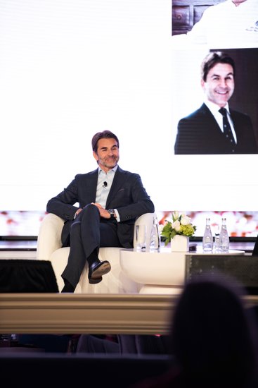 A speaker moment becomes the proof-of-room shot at an LA event