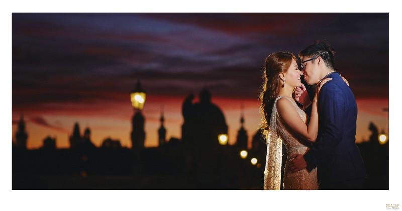 A magical kiss for the bride as the sky flares above