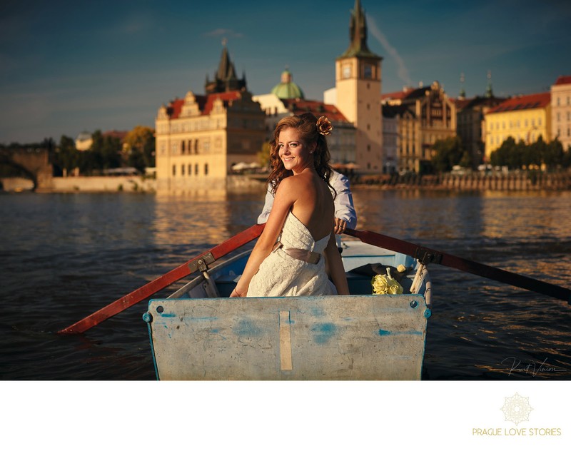 Beautiful bride & groom in rowboat in Prague