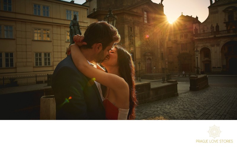 kiss for the sexy couple as the sun flares behind them