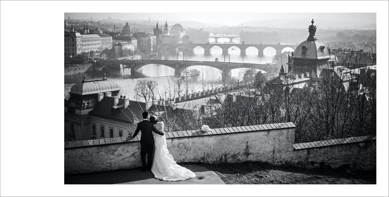 B&W photo of bride & groom overlooking Prague