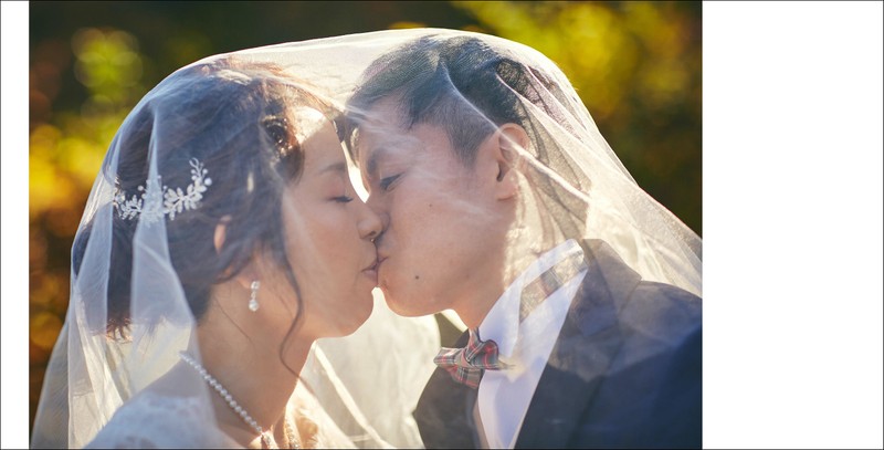 A kiss under the veil - Japanese newlyweds in Prague
