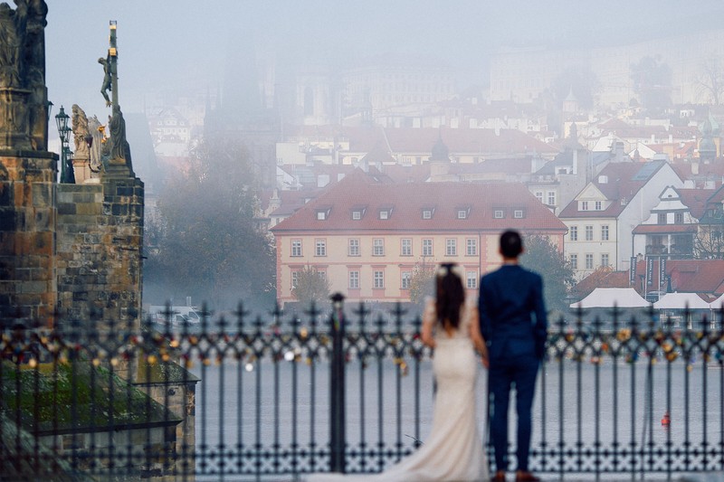 Bride & Groom enjoying the view of Prague shrouded in fog