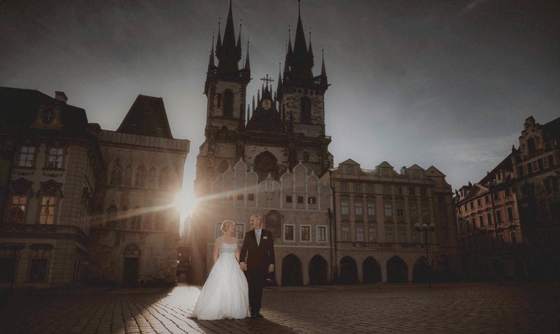 Newlyweds Walking In Sunlight Prague Old Town Square Sunrise