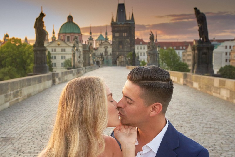 Romantic Kiss Atop Charles Bridge During Golden Light Hour Prague