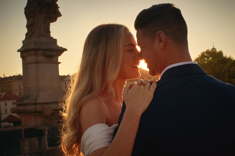 Gorgeous Couple Embraces In The Golden Light In Prague