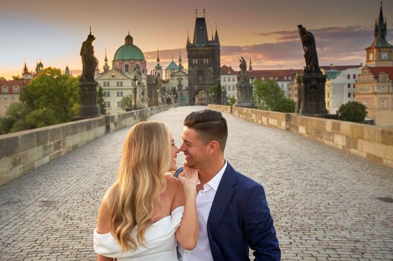 A gorgeous couple from California enjoying deserted Charles Bridge