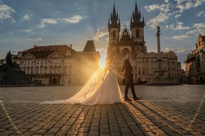 Newlyweds At Prague's Old Town Square At Sunrise