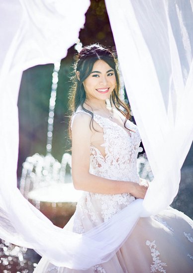 Portrait of the happy bride at the Wallenstein Garden