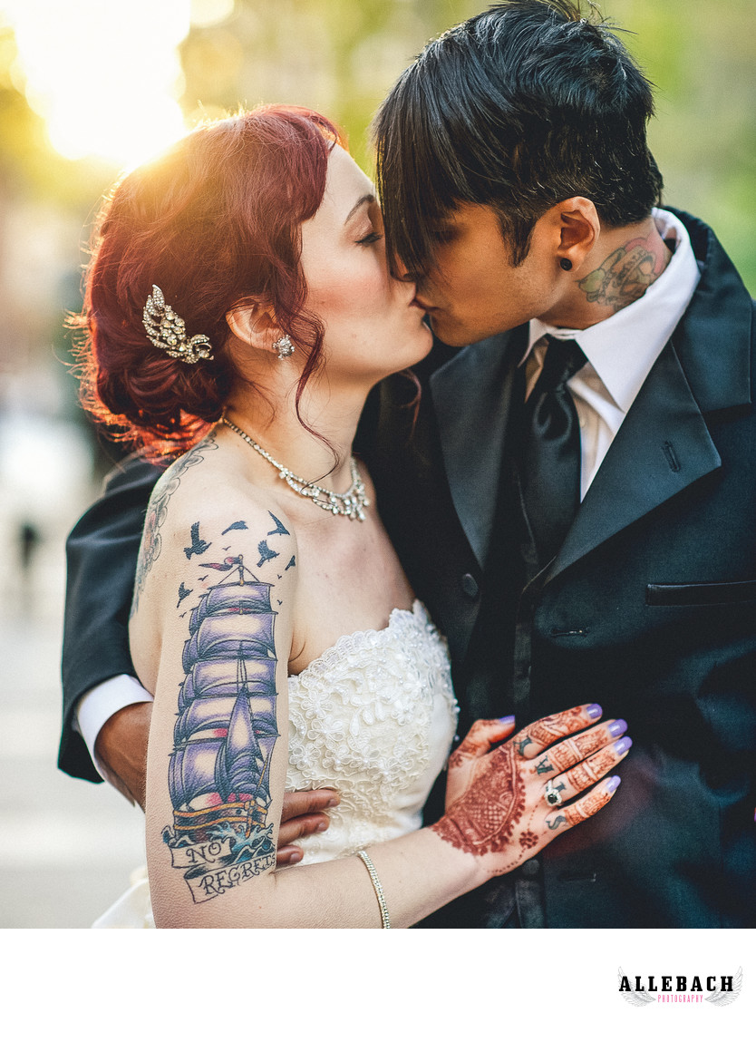 Tattooed Couple Kissing on Their Wedding Day