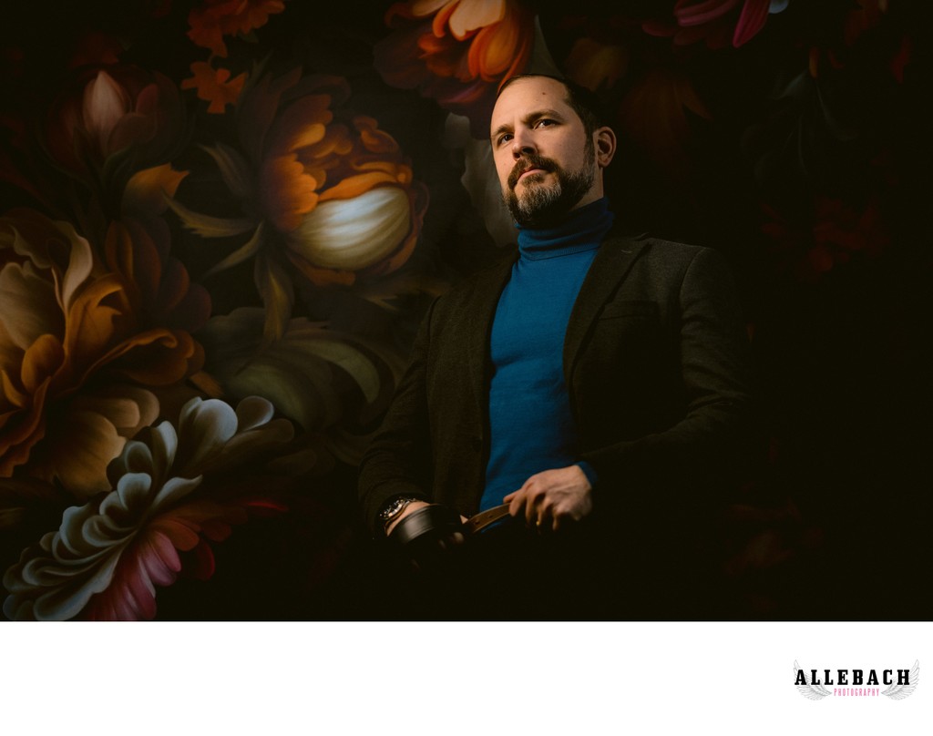 Man's Portrait on Flower Wall in Studio at Allebach Photography