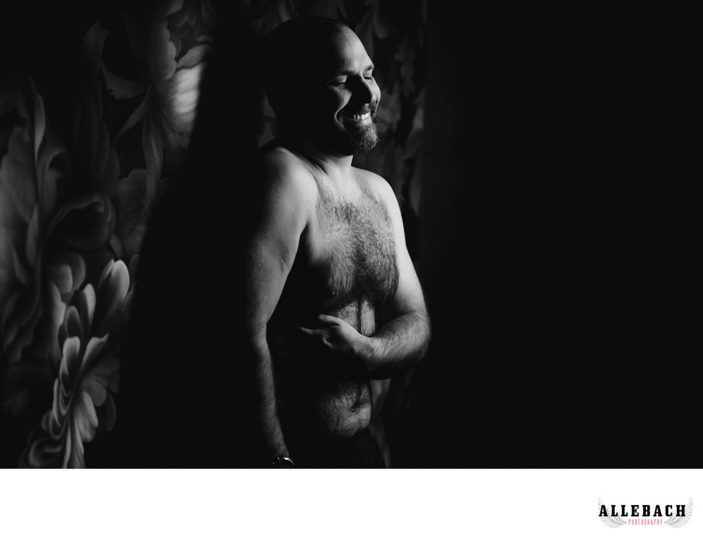 Laughing during Men's Boudoir Session at Allebach Photography