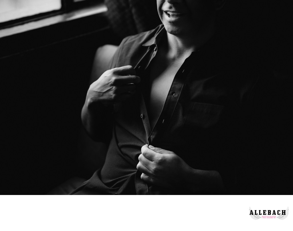 A men's boudoir session with an unbuttoned shirt