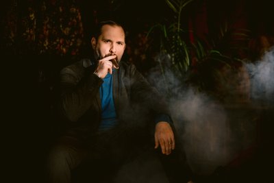 Man Smoking Cigar in Men's Portrait Session